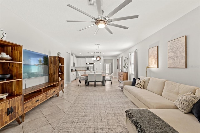 18620 Rococo Rd, Spring Hill, FL 34610 - living room featuring light tile patterned flooring and ceiling fan