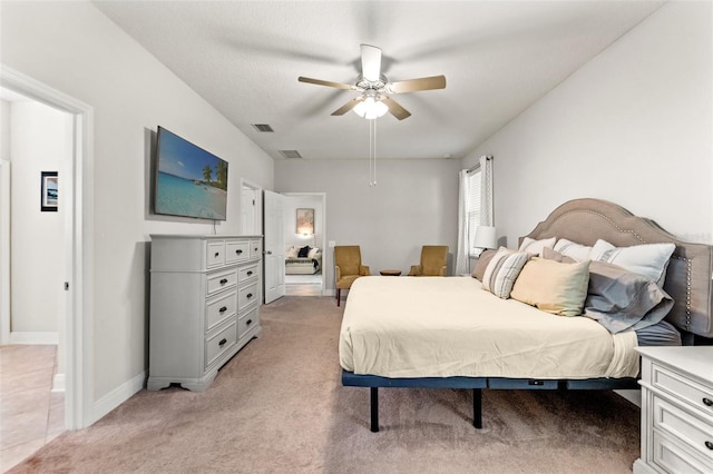18620 Rococo Rd, Spring Hill, FL 34610 - bedroom with light carpet, baseboards, and ceiling fan