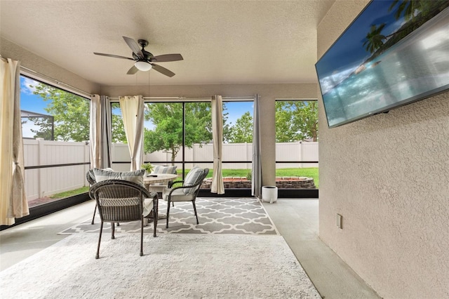 18620 Rococo Rd, Spring Hill, FL 34610 - sunroom / solarium featuring a textured wall, ceiling fan, healthy amount of natural light, and a textured ceiling