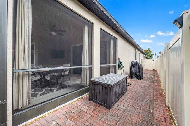 18620 Rococo Rd, Spring Hill, FL 34610 - fenced backyard featuring a gate, a sunroom, and a patio