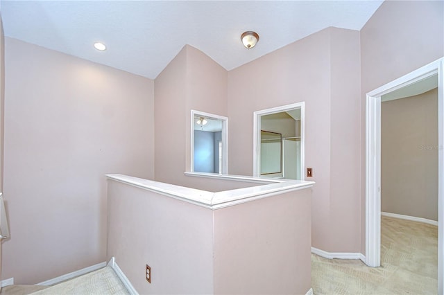4227 Bethpage Ct, Wesley Chapel, FL 33543 - hallway featuring an upstairs landing, light colored carpet, and baseboards