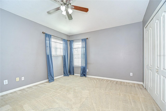 4227 Bethpage Ct, Wesley Chapel, FL 33543 - unfurnished bedroom with carpet flooring, a closet, baseboards, and a ceiling fan