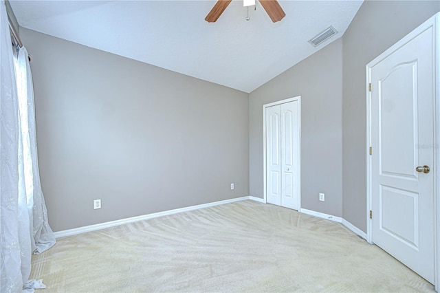 4227 Bethpage Ct, Wesley Chapel, FL 33543 - unfurnished bedroom featuring vaulted ceiling, light colored carpet, a closet, baseboards, and ceiling fan