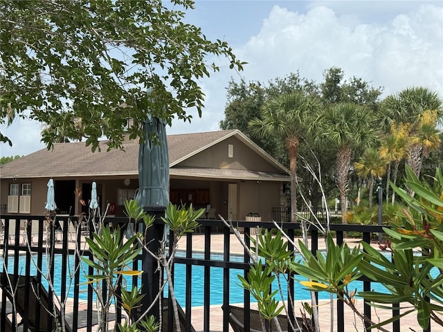 4227 Bethpage Ct, Wesley Chapel, FL 33543 - community pool featuring a patio