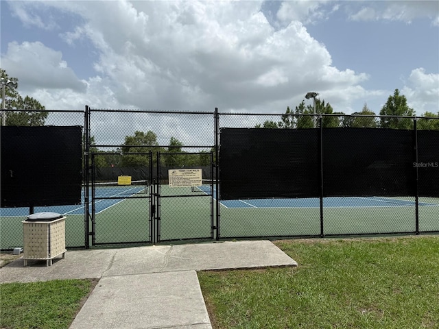 4227 Bethpage Ct, Wesley Chapel, FL 33543 - view of tennis court with a gate