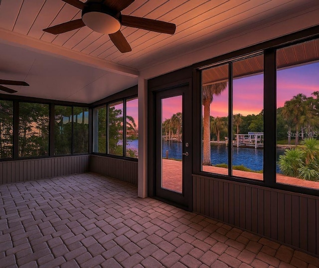5264 S Spy Glass Pt, Homosassa, FL 34448 - unfurnished sunroom featuring a ceiling fan, a water view, healthy amount of natural light, and lofted ceiling