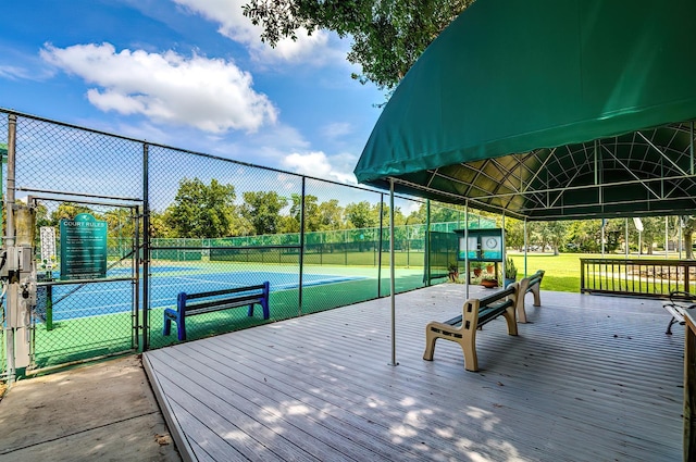 5264 S Spy Glass Pt, Homosassa, FL 34448 - wooden terrace featuring a tennis court and a gate