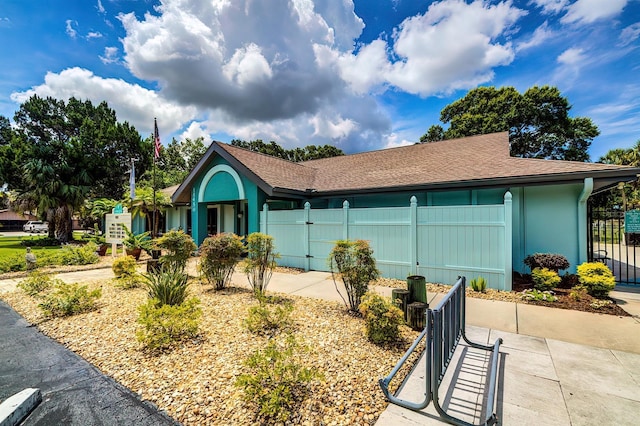5264 S Spy Glass Pt, Homosassa, FL 34448 - single story home with a gate, stucco siding, and a shingled roof