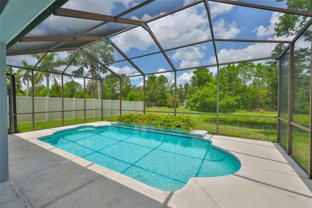 7114 Cromwell Park Ln, Apollo Beach, FL 33572 - view of swimming pool featuring a patio, glass enclosure, and view of scattered trees