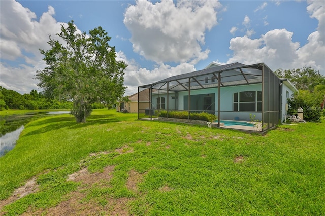 7114 Cromwell Park Ln, Apollo Beach, FL 33572 - back of property with a yard, glass enclosure, and a water view