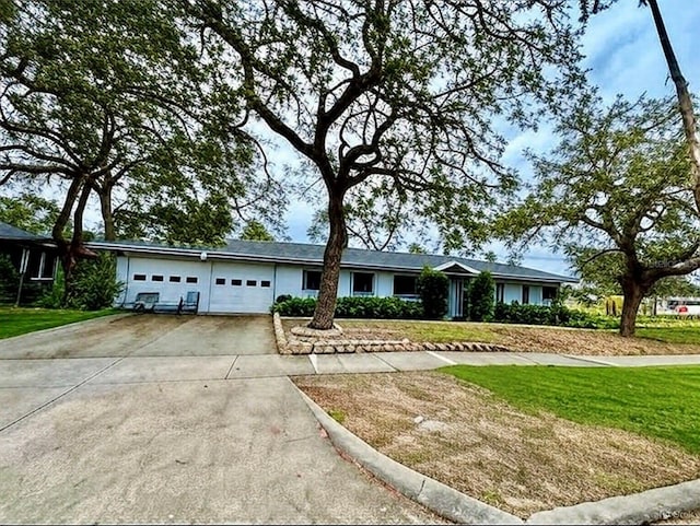 1005 Apache Trl, Clearwater, FL 33755 - single story home with a garage, driveway, and a front lawn
