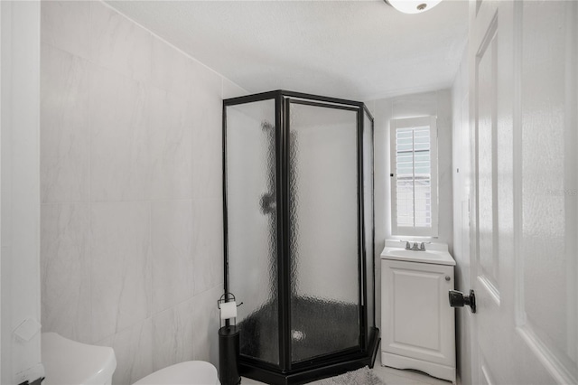 8356 W Tawny Rose, Crystal River, FL 34429 - bathroom featuring toilet, a stall shower, tile walls, and vanity