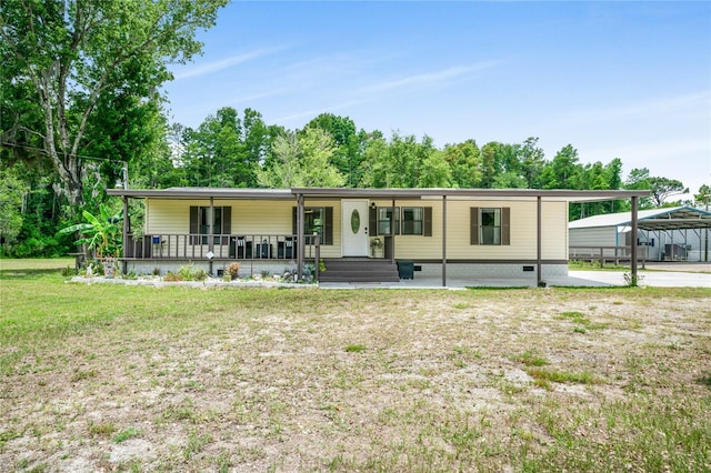 8356 W Tawny Rose, Crystal River, FL 34429 - view of front of house with covered porch, a front lawn, a carport, and crawl space