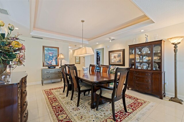 1 Beach Dr SE Unit 2011, Saint Petersburg, FL 33701 - dining area with a tray ceiling, light tile patterned floors, and baseboards