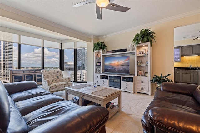 1 Beach Dr SE Unit 2011, Saint Petersburg, FL 33701 - living area featuring a ceiling fan, crown molding, healthy amount of natural light, a textured ceiling, and a city view