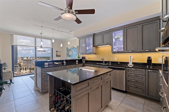1 Beach Dr SE Unit 2011, Saint Petersburg, FL 33701 - kitchen featuring dishwasher, a peninsula, floor to ceiling windows, ceiling fan, and dark countertops