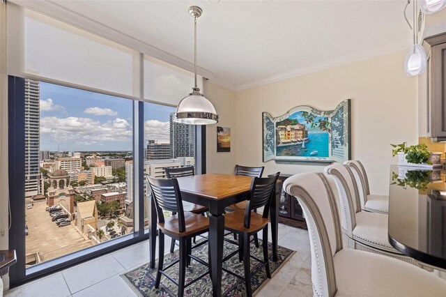 1 Beach Dr SE Unit 2011, Saint Petersburg, FL 33701 - dining space featuring crown molding, light tile patterned flooring, and a city view