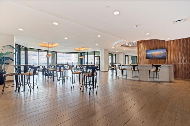 1 Beach Dr SE Unit 2011, Saint Petersburg, FL 33701 - dining space featuring expansive windows, wood finished floors, and recessed lighting