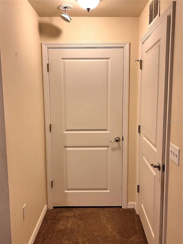 5351 Leisure Ln, New Port Richey, FL 34652 - doorway with carpet and baseboards