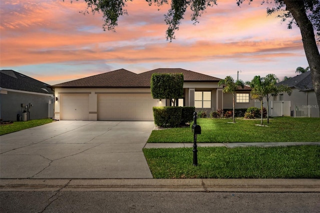 2814 Duncan Tree Cir, Valrico, FL 33594 - view of front of home with an attached garage, stucco siding, and concrete driveway