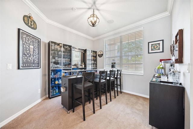 2814 Duncan Tree Cir, Valrico, FL 33594 - carpeted dining room featuring a chandelier, ornamental molding, and baseboards