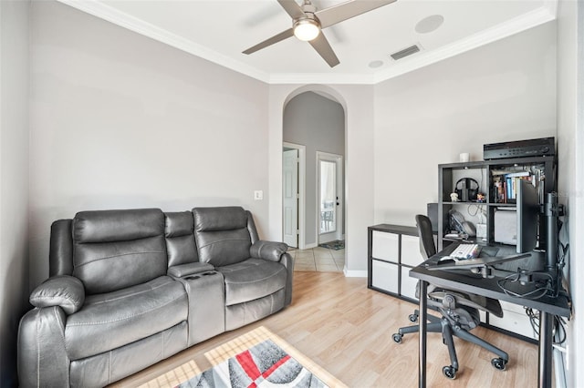 2814 Duncan Tree Cir, Valrico, FL 33594 - home office with arched walkways, ceiling fan, ornamental molding, wood finished floors, and baseboards