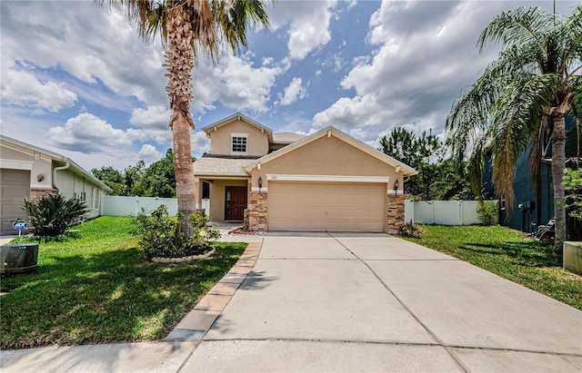 3305 Hoylake Ct, Land O Lakes, FL 34638 - traditional-style house featuring stucco siding, concrete driveway, a garage, and stone siding