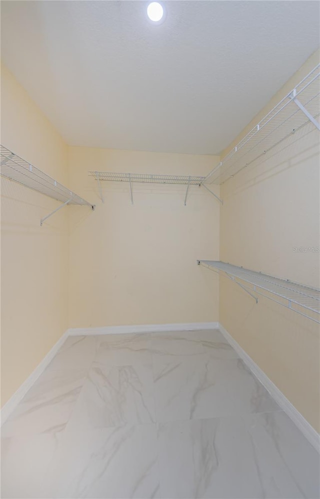 3305 Hoylake Ct, Land O Lakes, FL 34638 - spacious closet with light marble finish floors