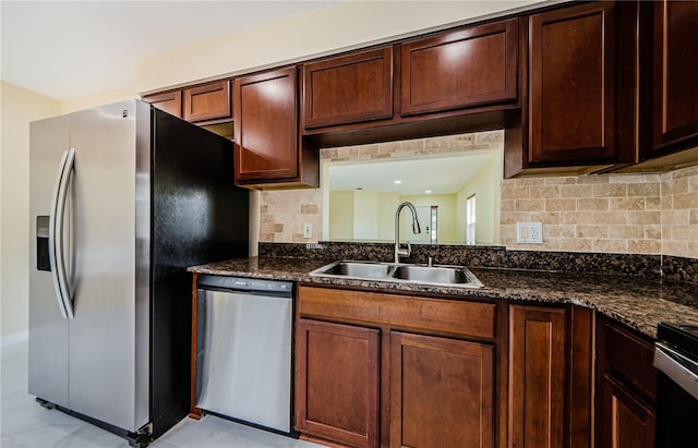 3305 Hoylake Ct, Land O Lakes, FL 34638 - kitchen with stainless steel appliances, backsplash, and dark stone countertops