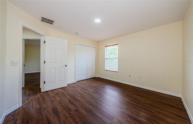 3305 Hoylake Ct, Land O Lakes, FL 34638 - unfurnished bedroom with dark wood finished floors and a closet