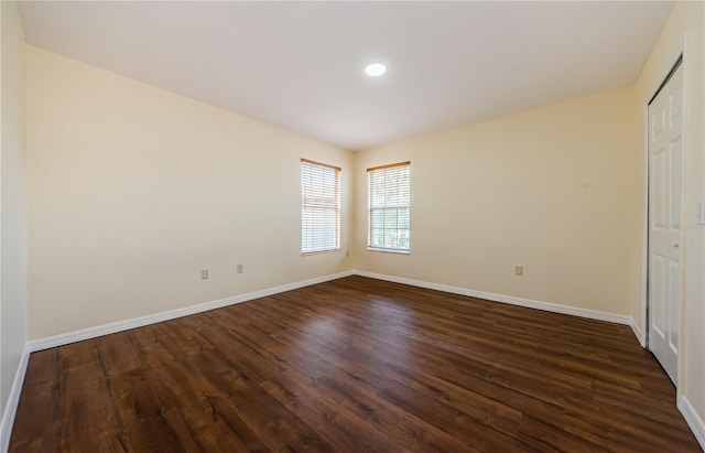 3305 Hoylake Ct, Land O Lakes, FL 34638 - unfurnished bedroom with dark wood-type flooring and recessed lighting