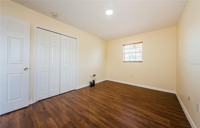 3305 Hoylake Ct, Land O Lakes, FL 34638 - unfurnished bedroom featuring dark wood finished floors and a closet