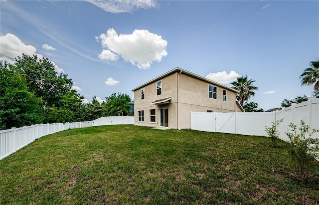 3305 Hoylake Ct, Land O Lakes, FL 34638 - rear view of property with a fenced backyard and stucco siding