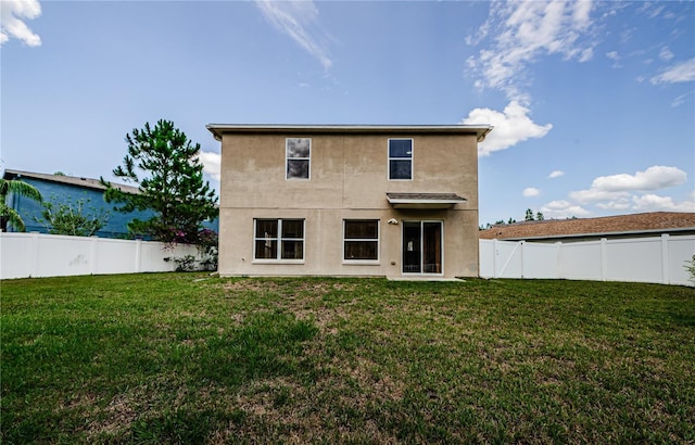 3305 Hoylake Ct, Land O Lakes, FL 34638 - rear view of house with a fenced backyard and stucco siding