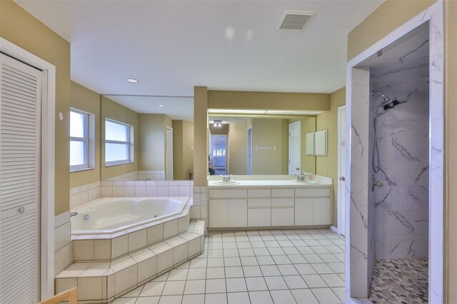 1034 Brighton Way, Lakeland, FL 33813 - full bath featuring a garden tub, double vanity, a closet, and a marble finish shower