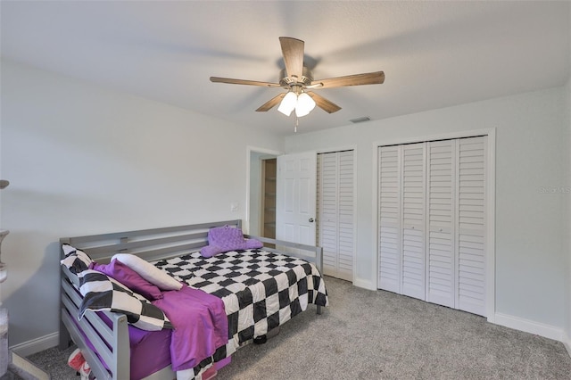 1034 Brighton Way, Lakeland, FL 33813 - carpeted bedroom with two closets, a ceiling fan, and baseboards