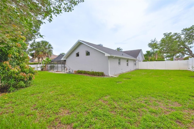 1034 Brighton Way, Lakeland, FL 33813 - view of yard featuring a lanai
