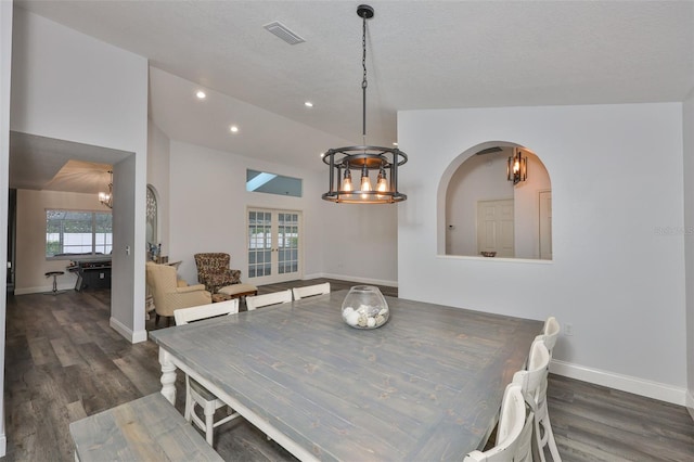 1034 Brighton Way, Lakeland, FL 33813 - dining space featuring a chandelier, wood finished floors, baseboards, recessed lighting, and arched walkways