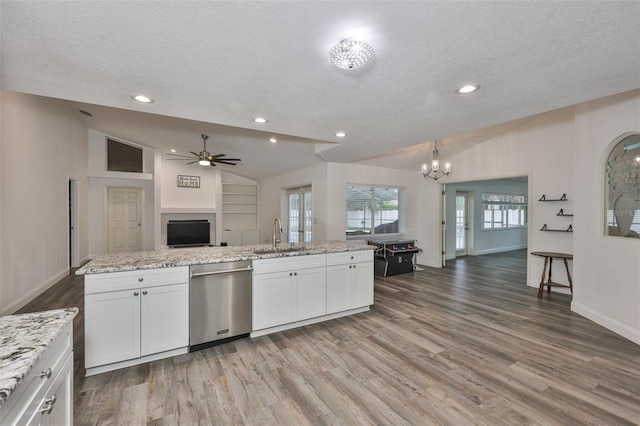 1034 Brighton Way, Lakeland, FL 33813 - kitchen featuring stainless steel dishwasher, a textured ceiling, a sink, ceiling fan, and a chandelier