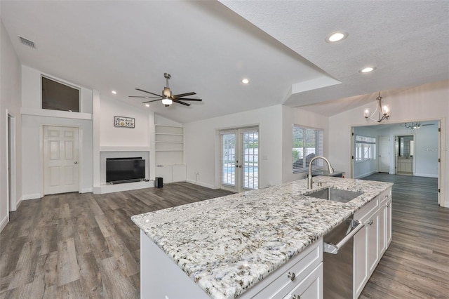 1034 Brighton Way, Lakeland, FL 33813 - kitchen with a sink, french doors, vaulted ceiling, ceiling fan, and white cabinets