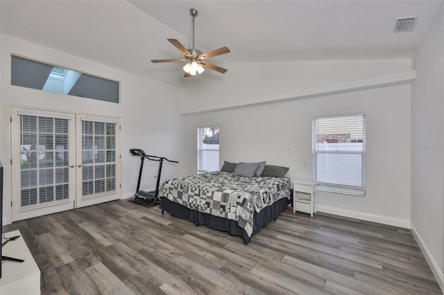 1034 Brighton Way, Lakeland, FL 33813 - bedroom with vaulted ceiling, wood finished floors, access to exterior, a skylight, and french doors