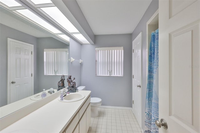 1034 Brighton Way, Lakeland, FL 33813 - full bathroom featuring double vanity, toilet, baseboards, and tile patterned flooring