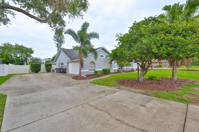 1034 Brighton Way, Lakeland, FL 33813 - view of front of house featuring a garage, concrete driveway, and stucco siding