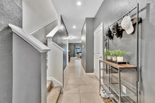 3320 Pleasant Willow Ct, Brandon, FL 33511 - hall with light tile patterned floors, stairs, a textured wall, and recessed lighting