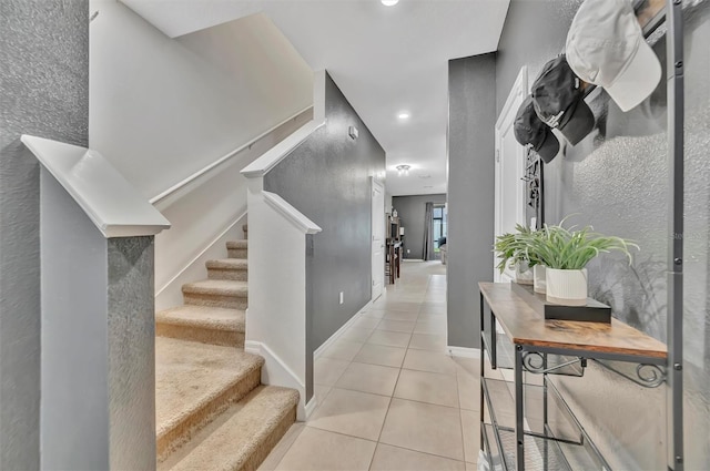 3320 Pleasant Willow Ct, Brandon, FL 33511 - corridor with light tile patterned flooring, stairway, recessed lighting, and baseboards