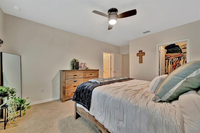 3320 Pleasant Willow Ct, Brandon, FL 33511 - bedroom featuring light colored carpet, baseboards, a ceiling fan, and a walk in closet