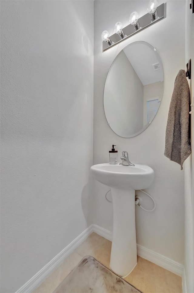 3320 Pleasant Willow Ct, Brandon, FL 33511 - bathroom featuring tile patterned flooring, baseboards, and a sink