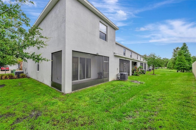 3320 Pleasant Willow Ct, Brandon, FL 33511 - back of property featuring stucco siding, a lawn, and cooling unit