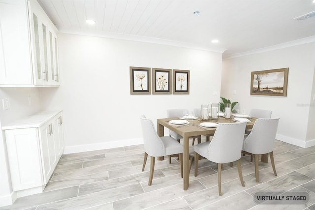 913 Spindle Palm Way, Apollo Beach, FL 33572 - dining space with recessed lighting, crown molding, baseboards, and wood ceiling