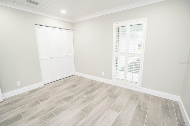 913 Spindle Palm Way, Apollo Beach, FL 33572 - unfurnished bedroom with light wood-style flooring, multiple windows, baseboards, and recessed lighting